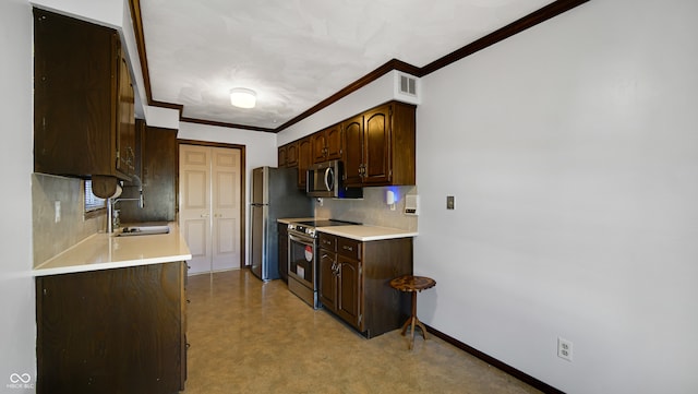 kitchen with stainless steel appliances, light carpet, sink, crown molding, and dark brown cabinets