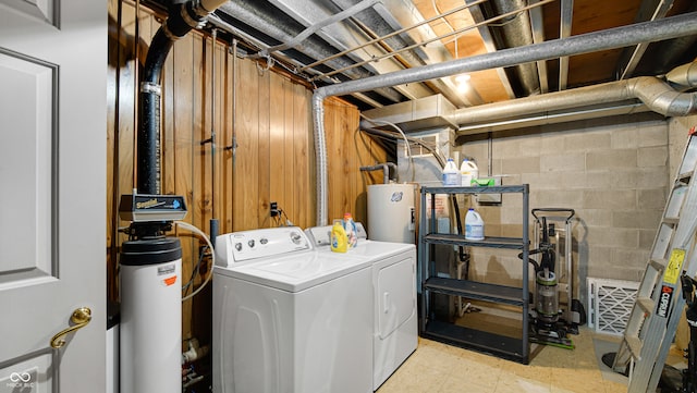 laundry room with washer and dryer and water heater