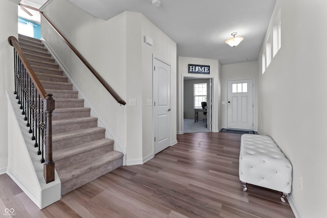 foyer with plenty of natural light and hardwood / wood-style floors