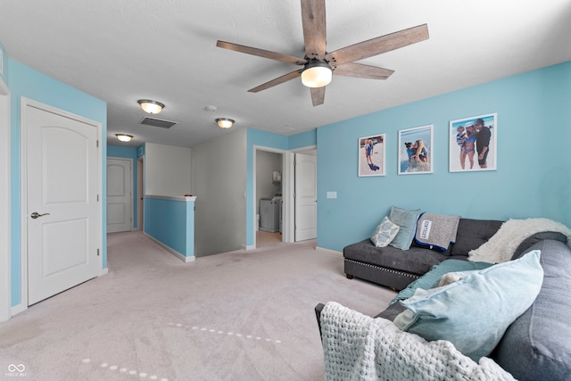 living room featuring light colored carpet and ceiling fan