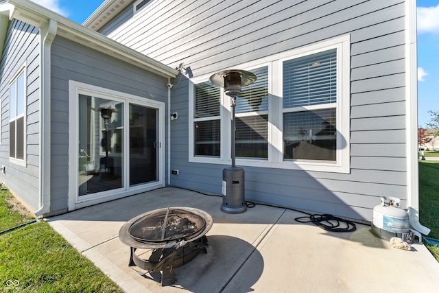 view of patio / terrace featuring an outdoor fire pit