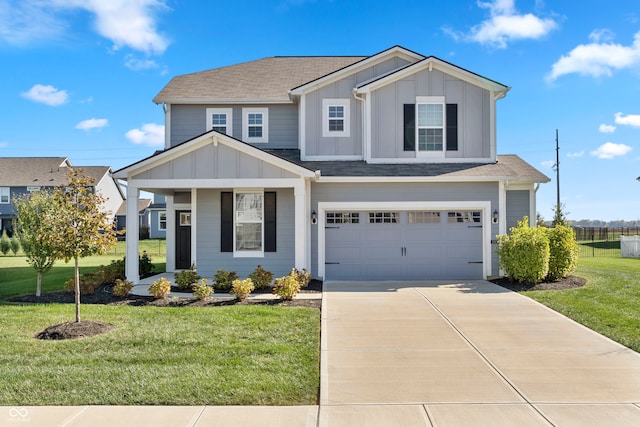 view of front of home featuring a front lawn and a garage