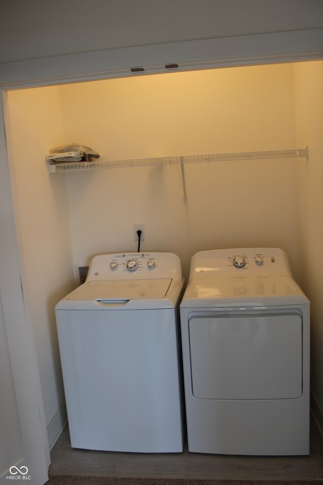 laundry room featuring washer and clothes dryer