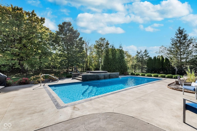 view of swimming pool with a patio area and a jacuzzi