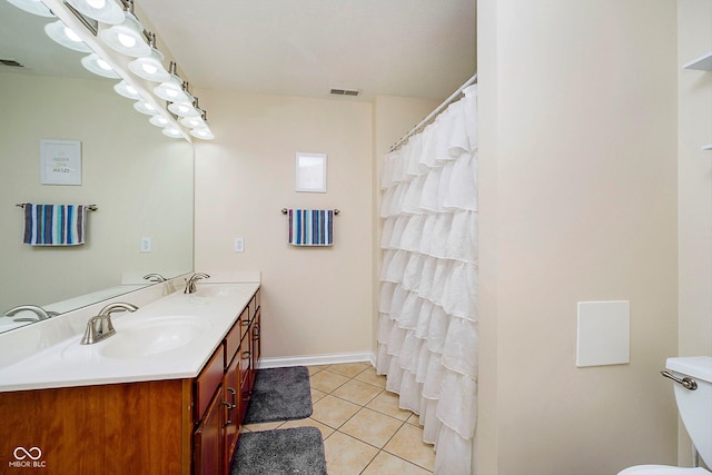 bathroom featuring tile patterned floors and vanity