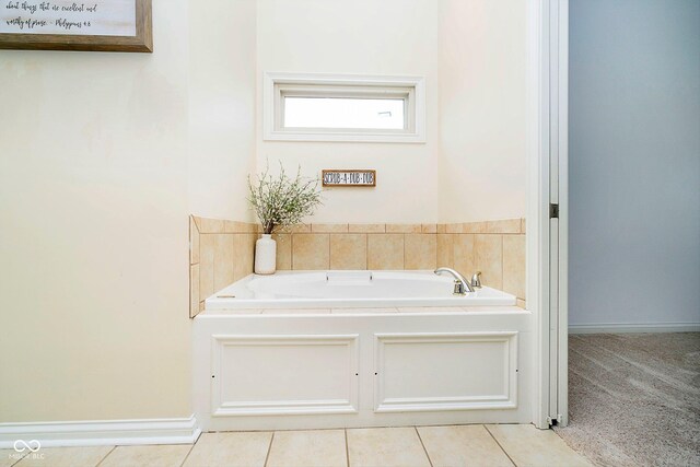 bathroom featuring tile patterned flooring and a bathtub