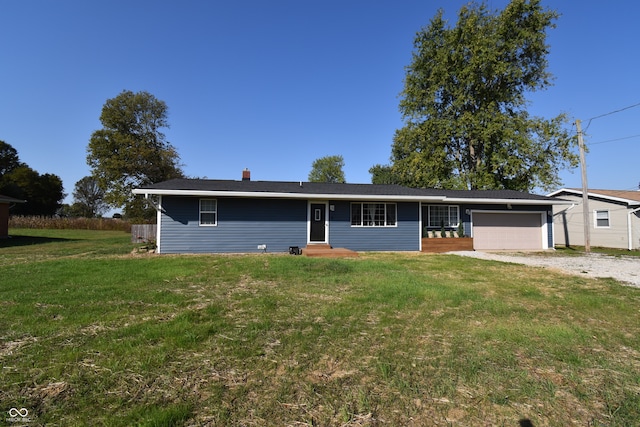 ranch-style home with a front yard and a garage