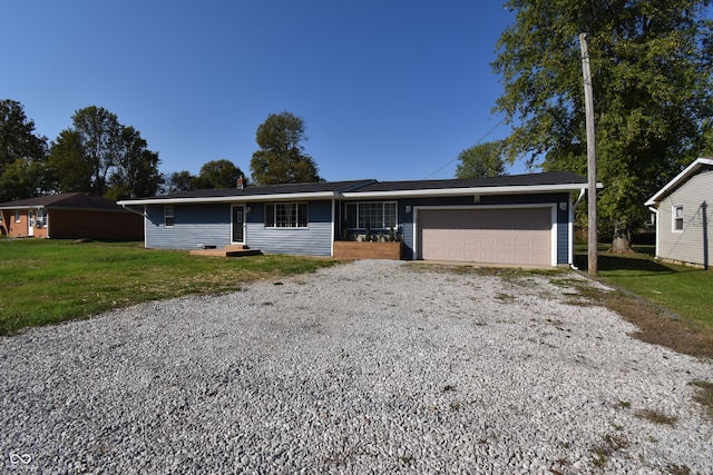 ranch-style home with a front yard and a garage