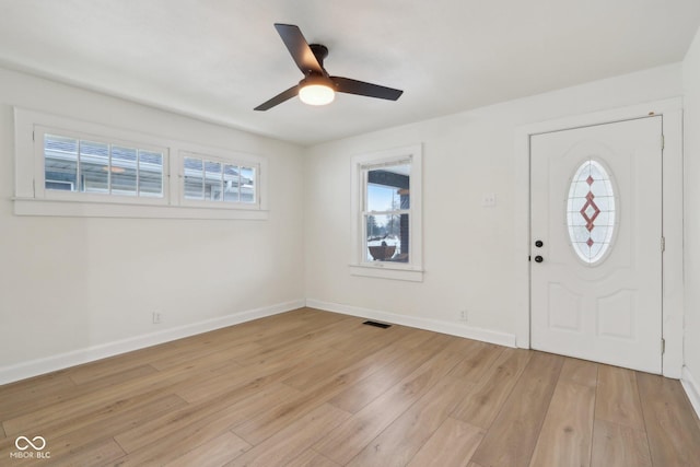 entrance foyer with ceiling fan and light wood-type flooring