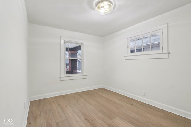 empty room with light hardwood / wood-style floors