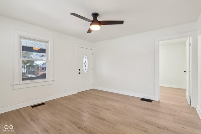 foyer entrance featuring ceiling fan and light wood-type flooring