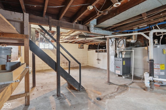 basement with heating unit and water heater