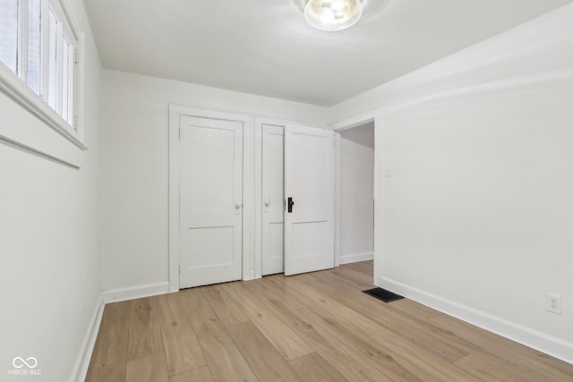 unfurnished bedroom featuring light hardwood / wood-style floors