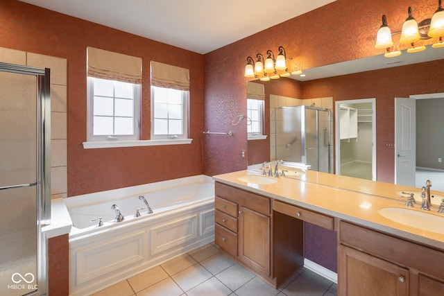 bathroom with tile patterned floors, vanity, and plus walk in shower