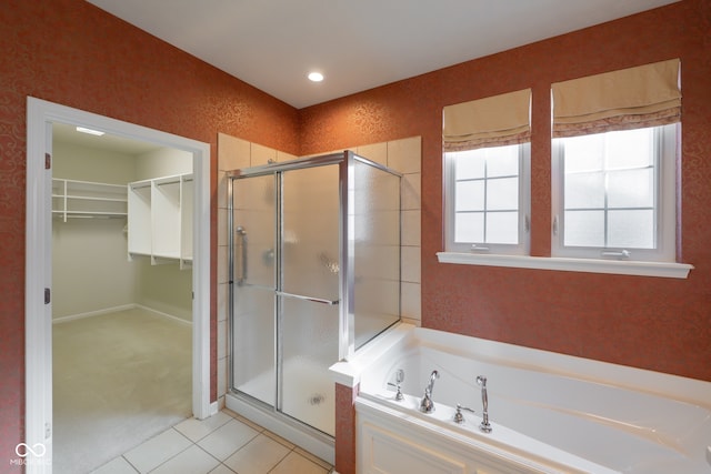 bathroom with tile patterned flooring and independent shower and bath