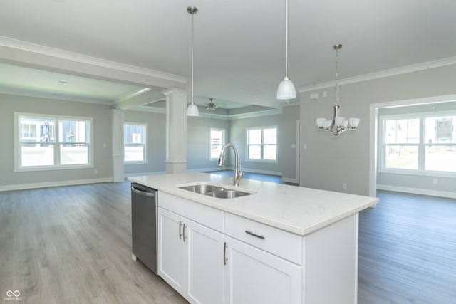 kitchen with light wood-type flooring, decorative columns, ceiling fan with notable chandelier, sink, and white cabinetry