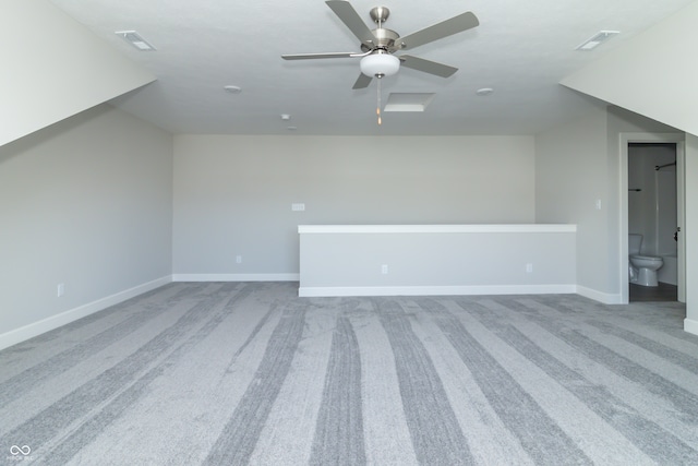 additional living space featuring carpet flooring and ceiling fan