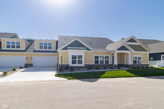 4435 W Preserve Pass, New Palestine, IN 46163 - view of front of home featuring driveway, a front yard, board and batten siding, and a garage
