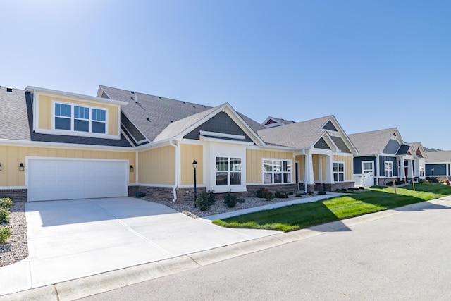 4435 W Preserve Pass, New Palestine, IN 46163 - craftsman-style house featuring board and batten siding, a front lawn, a garage, and concrete driveway