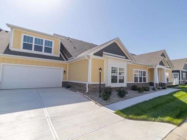 4435 W Preserve Pass, New Palestine, IN 46163 - craftsman-style house with board and batten siding, concrete driveway, roof with shingles, a garage, and a front yard