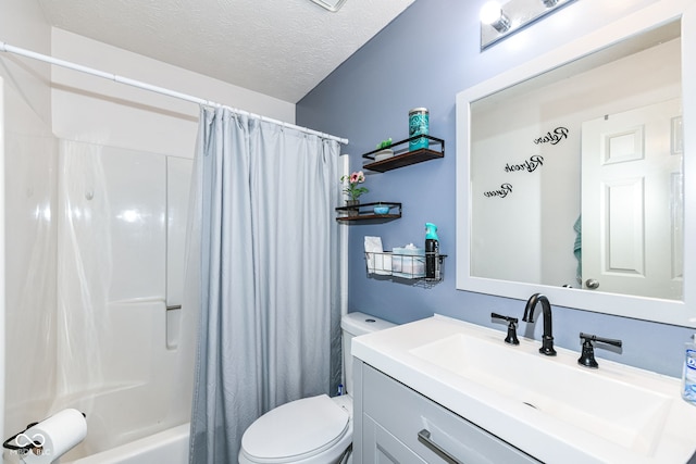 bathroom featuring shower / tub combo, toilet, a textured ceiling, and vanity