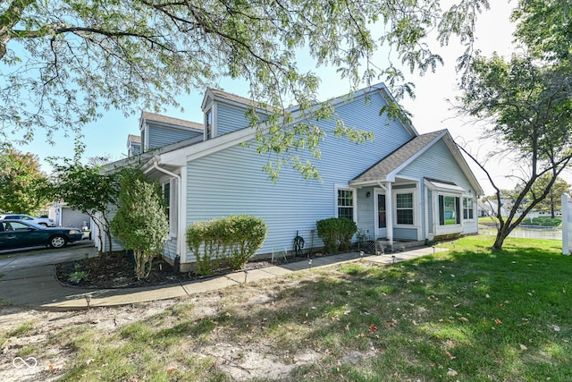 view of property exterior featuring a lawn