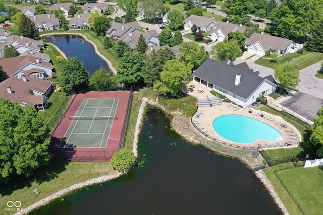 drone / aerial view featuring a residential view and a water view
