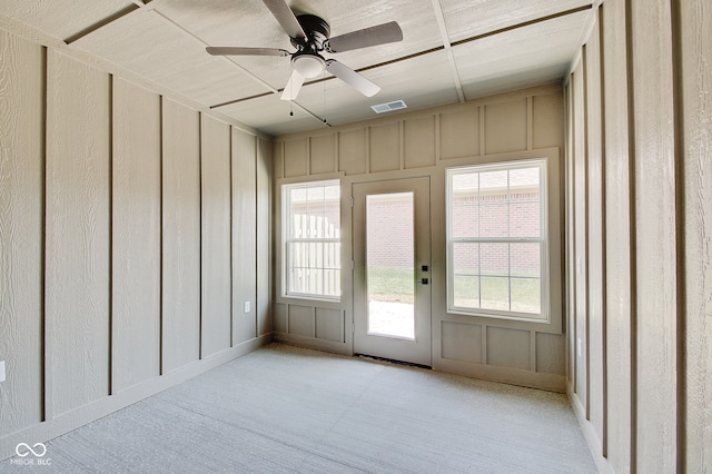 doorway featuring ceiling fan