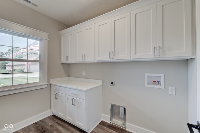 clothes washing area with dark hardwood / wood-style floors, hookup for a washing machine, cabinets, and electric dryer hookup