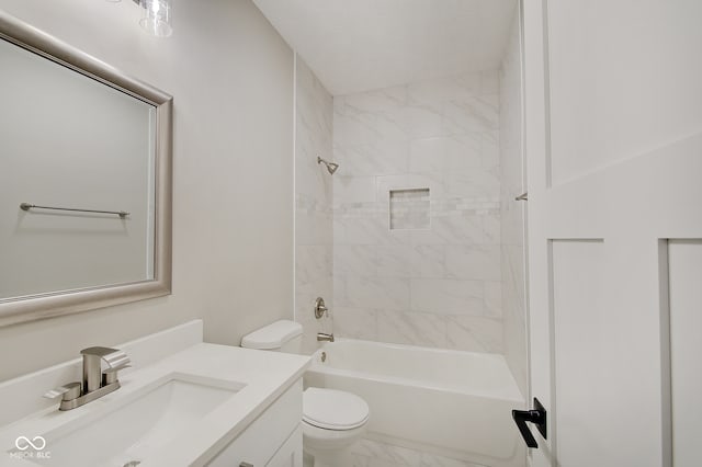 full bathroom featuring vanity, toilet, and tiled shower / bath combo