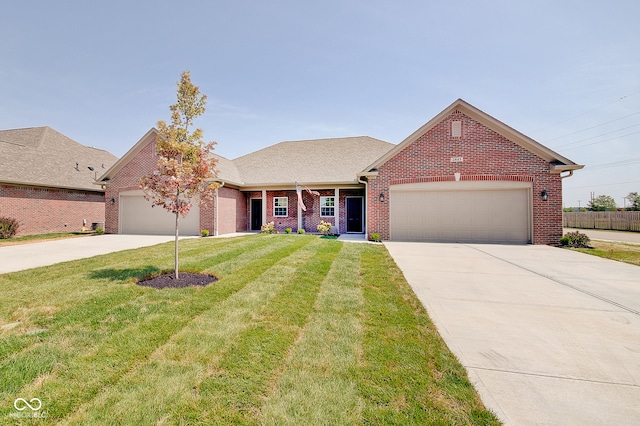 view of front facade featuring a front yard and a garage