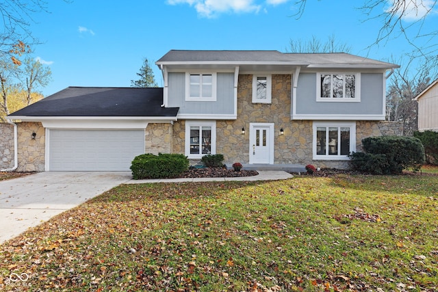 view of front facade with a garage and a front lawn