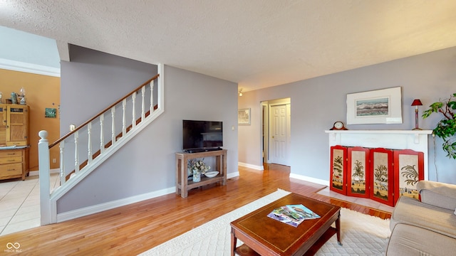 living room featuring hardwood / wood-style floors and a textured ceiling