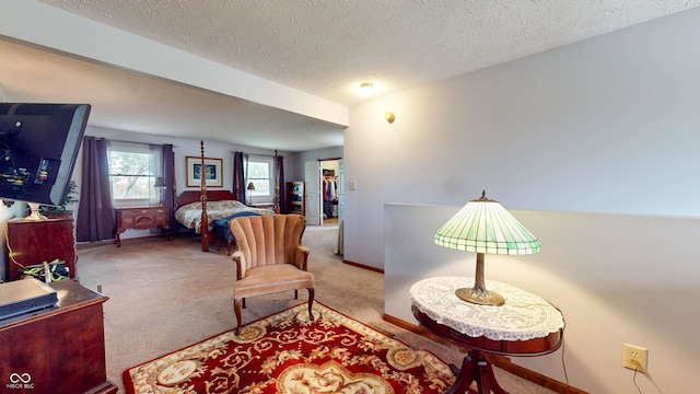 carpeted bedroom featuring a textured ceiling