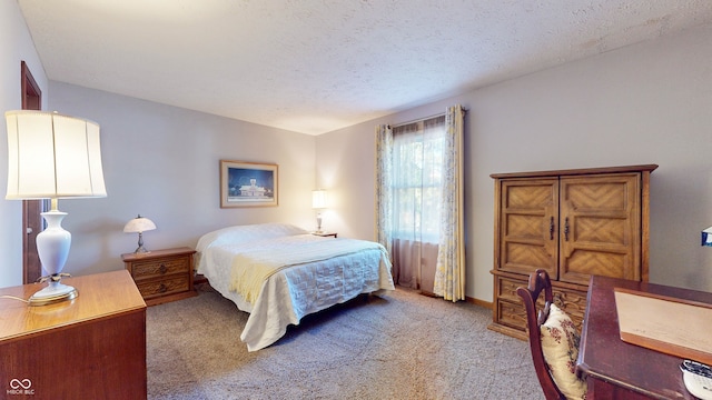 bedroom featuring light carpet and a textured ceiling