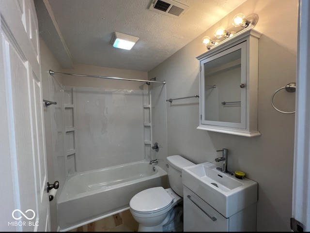 full bathroom with toilet, washtub / shower combination, vanity, and a textured ceiling