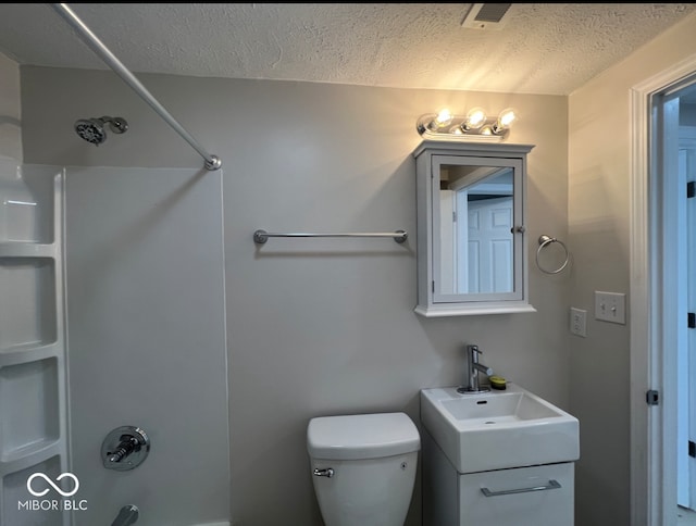 bathroom featuring walk in shower, toilet, vanity, and a textured ceiling