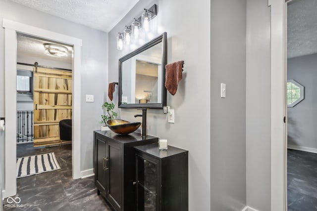 bathroom featuring vanity and a textured ceiling