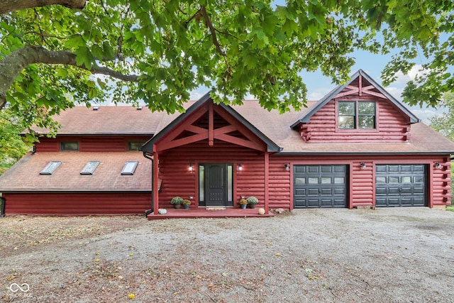 log cabin featuring a garage