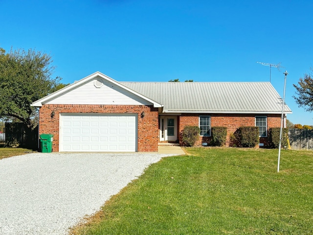 single story home with a front yard and a garage