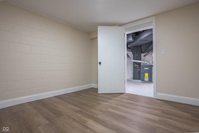 spare room featuring wood-type flooring