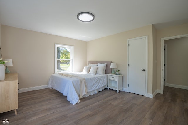 bedroom with hardwood / wood-style floors