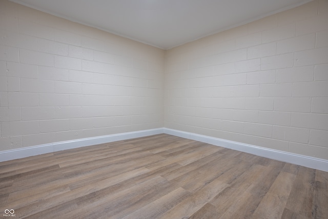 spare room featuring light wood-type flooring