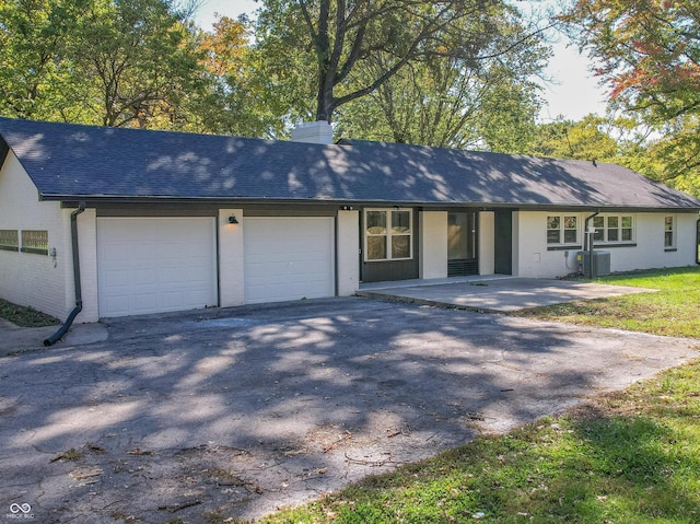 single story home featuring a garage