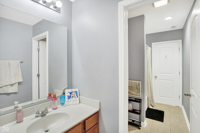 bathroom with vanity and tile patterned floors