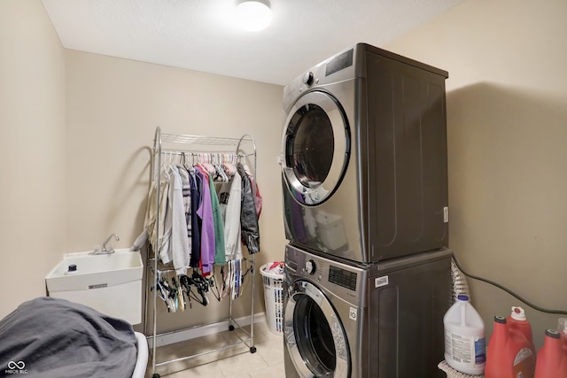 washroom with stacked washer and clothes dryer