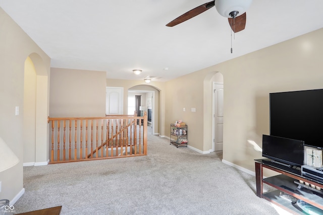 living room featuring light carpet and ceiling fan