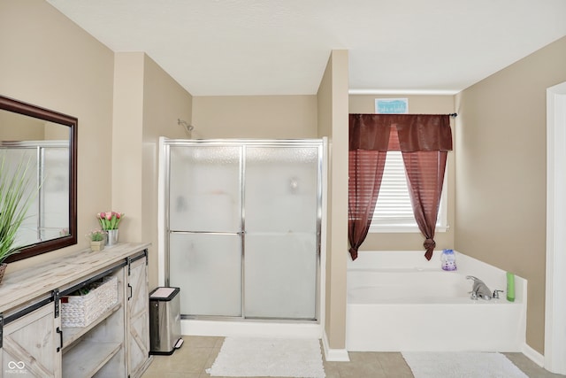 bathroom featuring vanity, plus walk in shower, and tile patterned floors