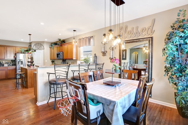 dining space featuring dark hardwood / wood-style flooring