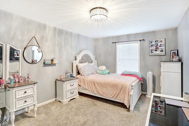 bedroom featuring light carpet